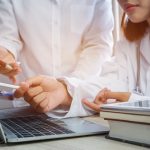 Medical professionals working with scanned images.