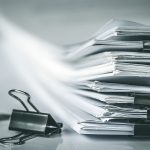 Close up stacking of office working document with paper clip folder.